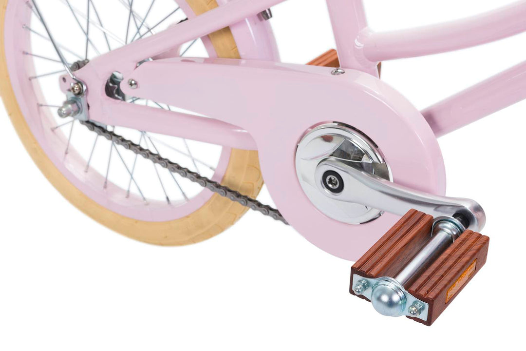 Pink Banwood Classic Bicycle pedal and chain close up