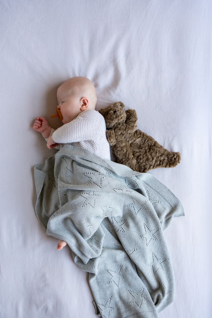 Baby in blanket sleeping with Nana Huchy Benny The Bear Hoochy Coochie