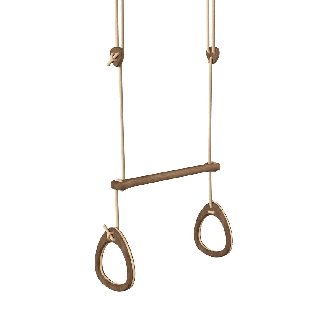 Pair of walnut gymnastic rings hanging on an acrobat bar with beige ropes against a white background