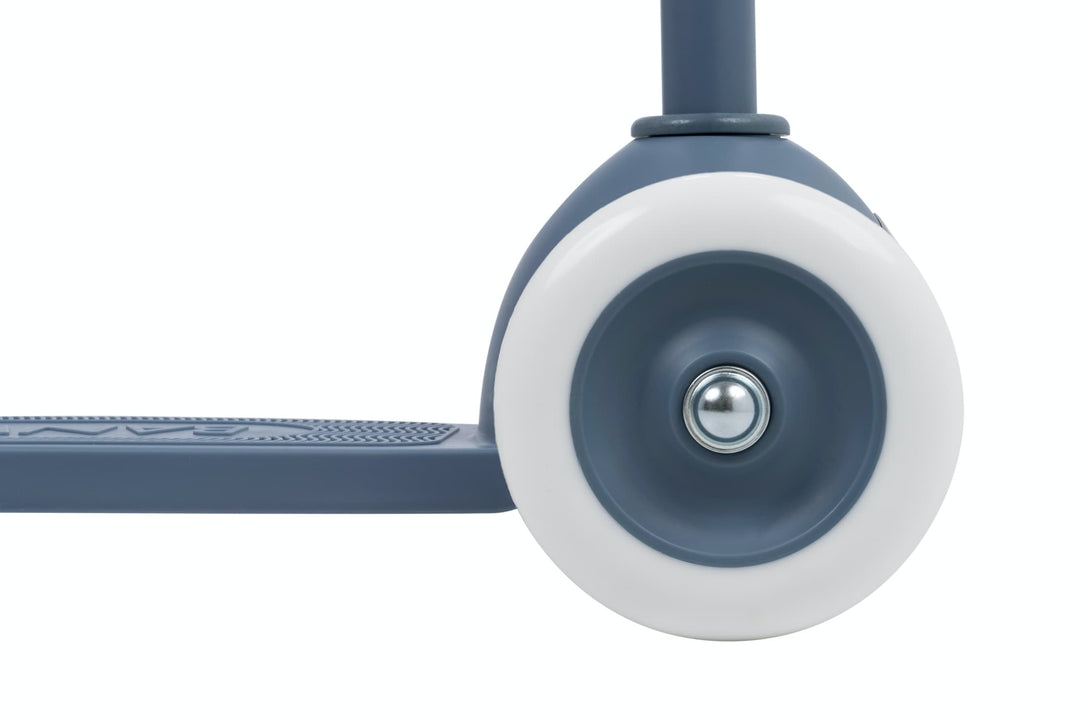 Close-up of a blue front scooter wheel on a white background