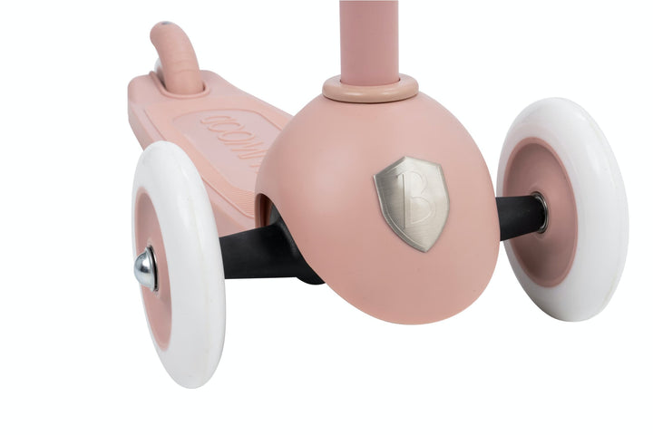 Dusty rose scooter with white wheels on a white background