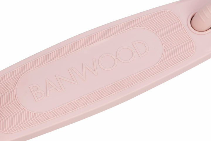 Close-up of a pink scooter deck with 'Banwood' branding on a white background