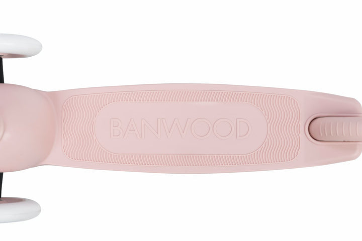 Close-up of a pink scooter deck with 'BANWOOD' branding on a white background
