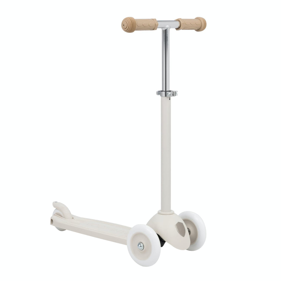 Children's scooter with beige handlebar on a white background