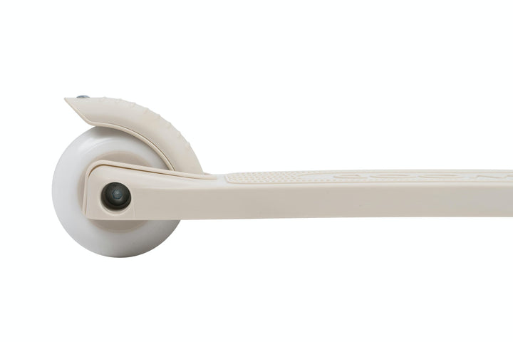 Close-up of a beige scooter wheel on a white background