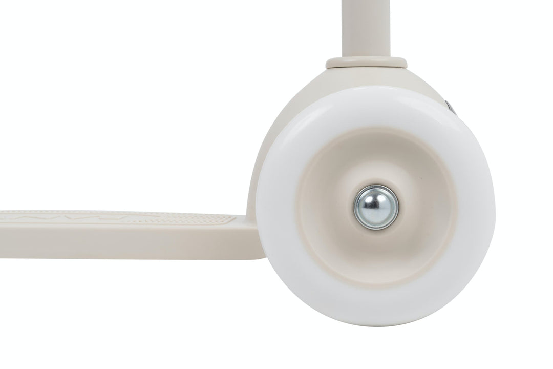 Close-up of a white scooter wheel on a  white background