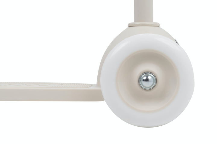 Close-up of a white scooter wheel on a  white background