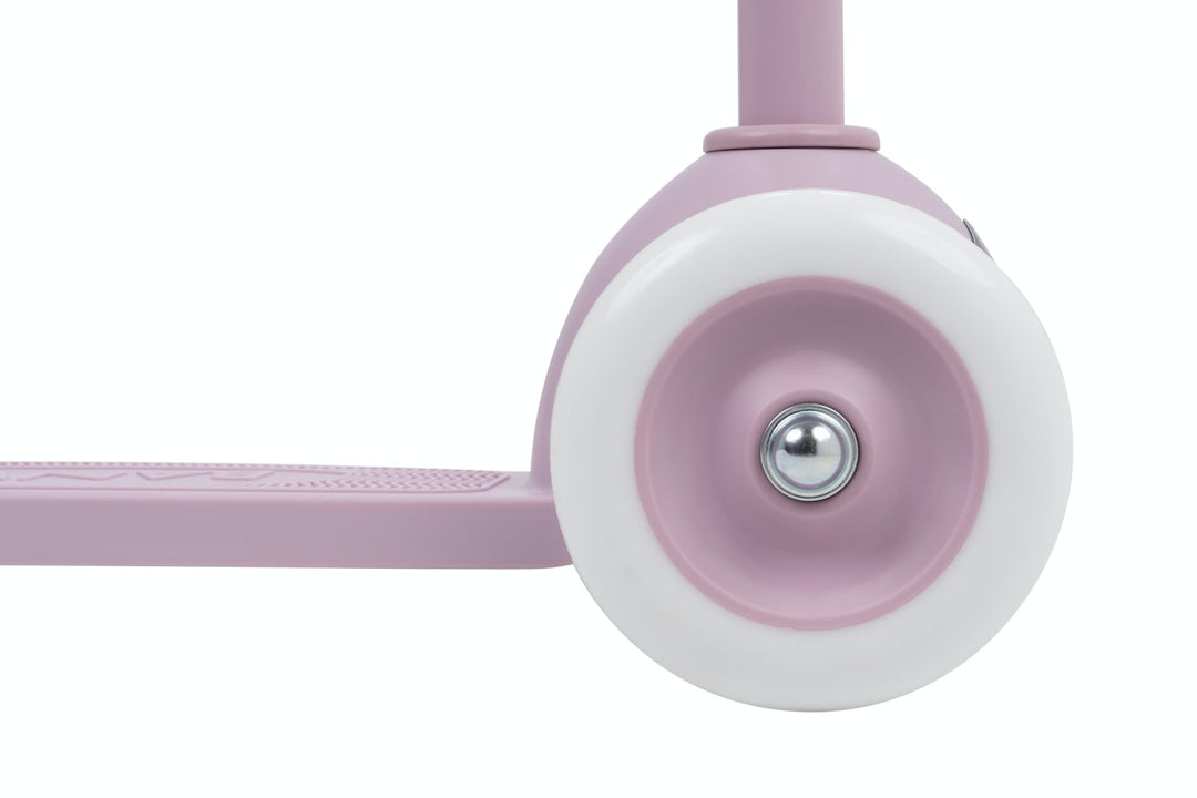 Close-up of a lavender scooter wheel on a white background