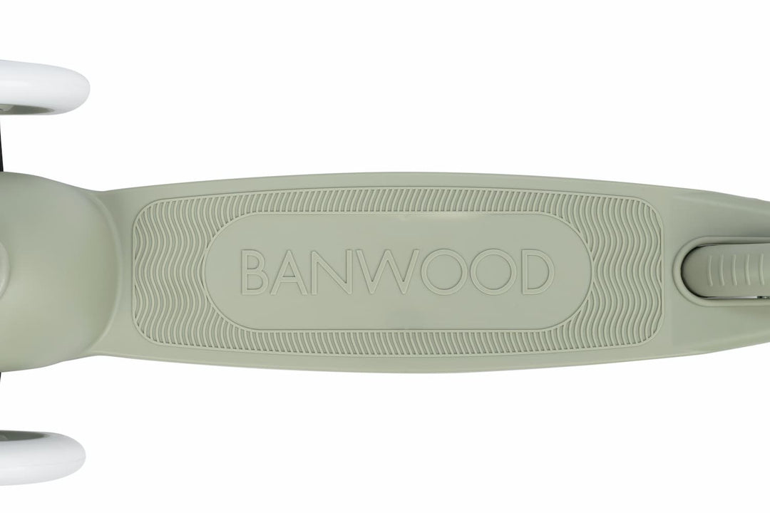 Close-up of a green children's scooter deck with 'BANWOOD' branding on a white background