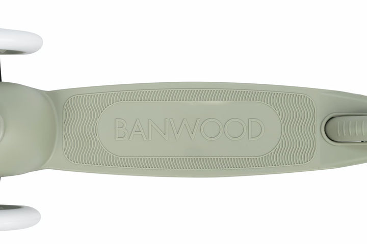 Close-up of a green children's scooter deck with 'BANWOOD' branding on a white background