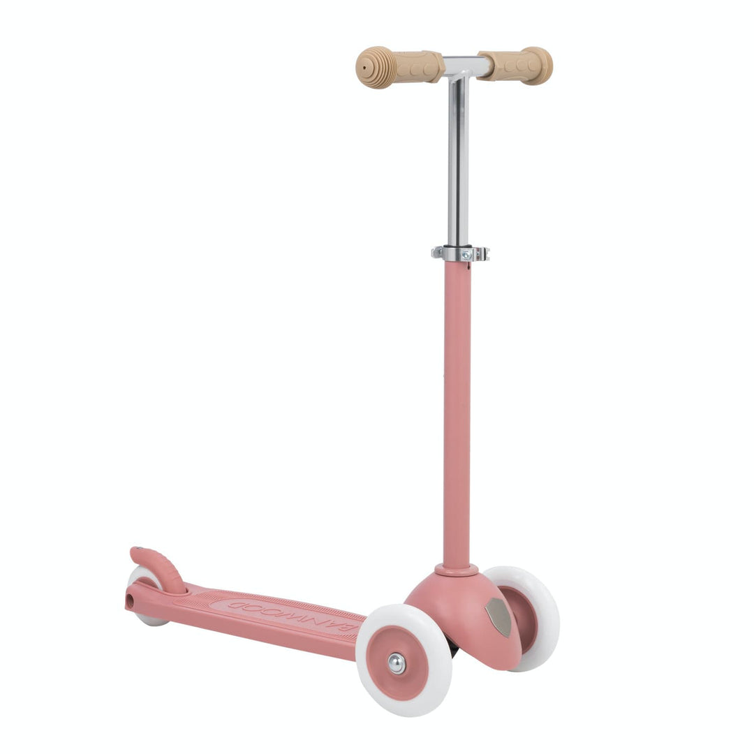 Pink scooter with white wheels on a white background