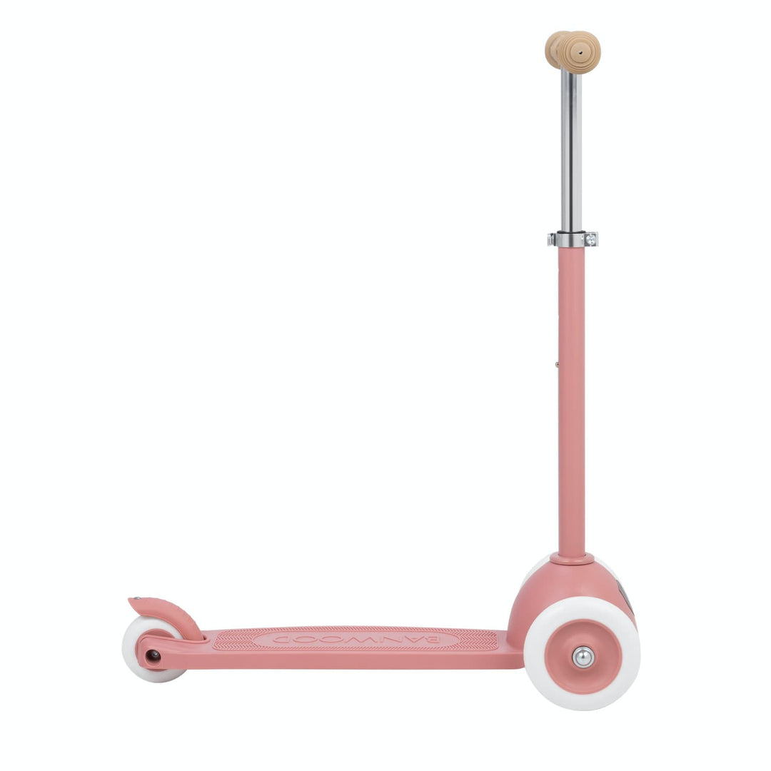 Pink scooter with a white wheels on a white background
