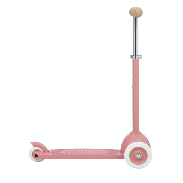 Pink scooter with a white wheels on a white background