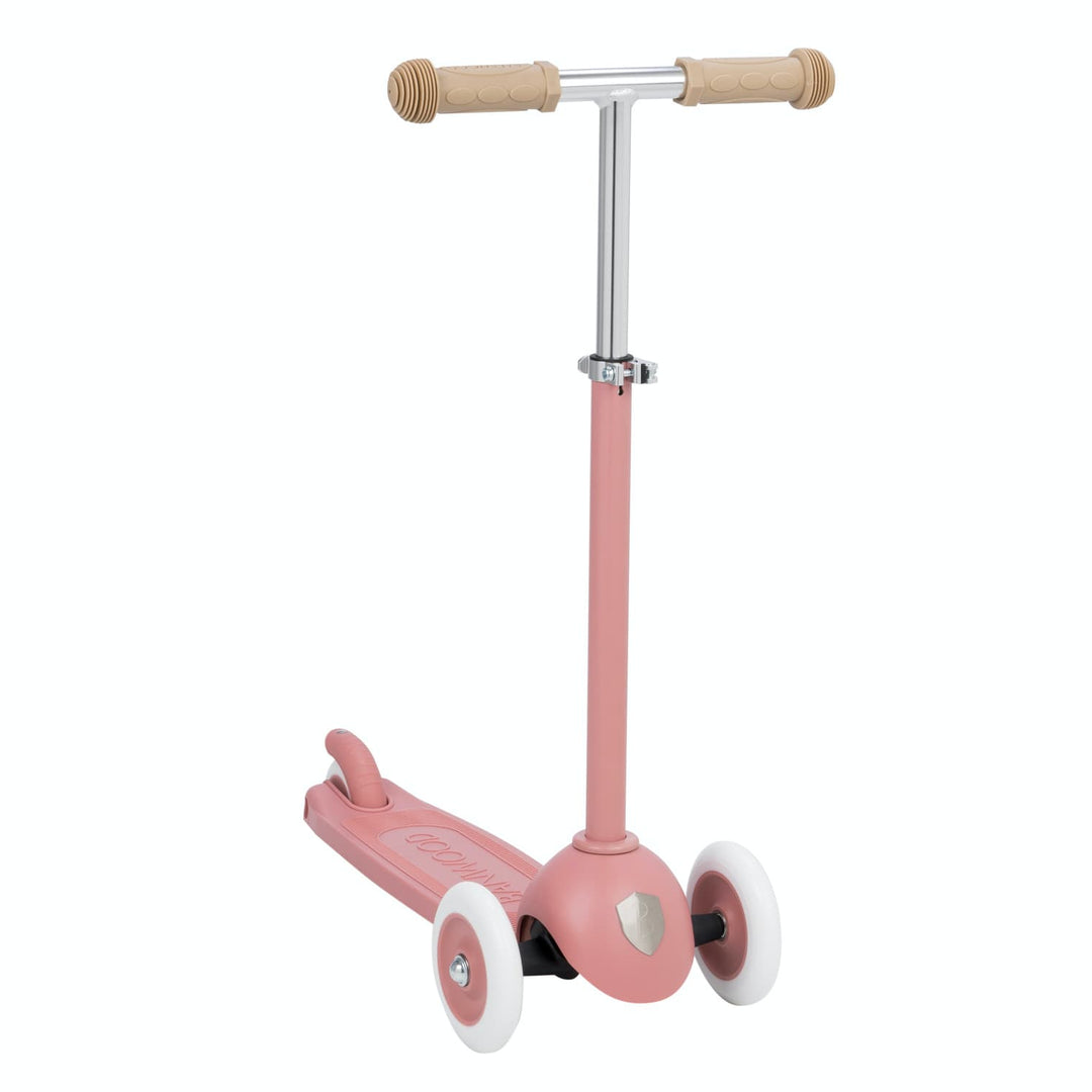 Pink scooter with rubber grip handlebar on a white background