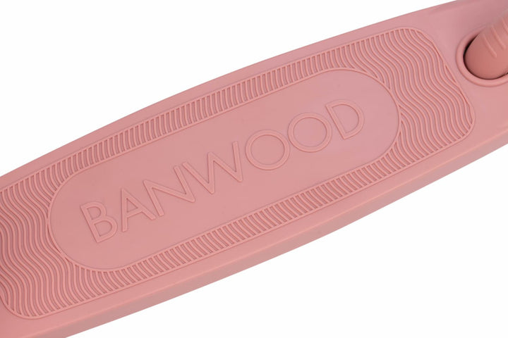 Pink scooter deck with 'Banwood' branding on a white background