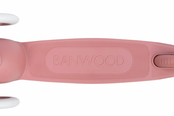 Pink children's scooter with 'Banwood' branding on a white background
