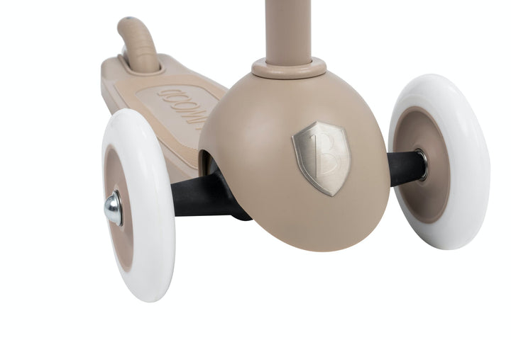 Close-up of a beige scooter with white wheels on a white background