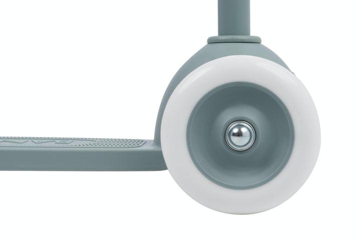 Close-up of a scooter wheel with a white rim and teal centre on a white background
