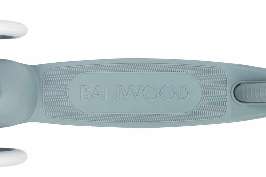 Close-up of a teal children's scooter deck with 'Banwood' branding on a white background