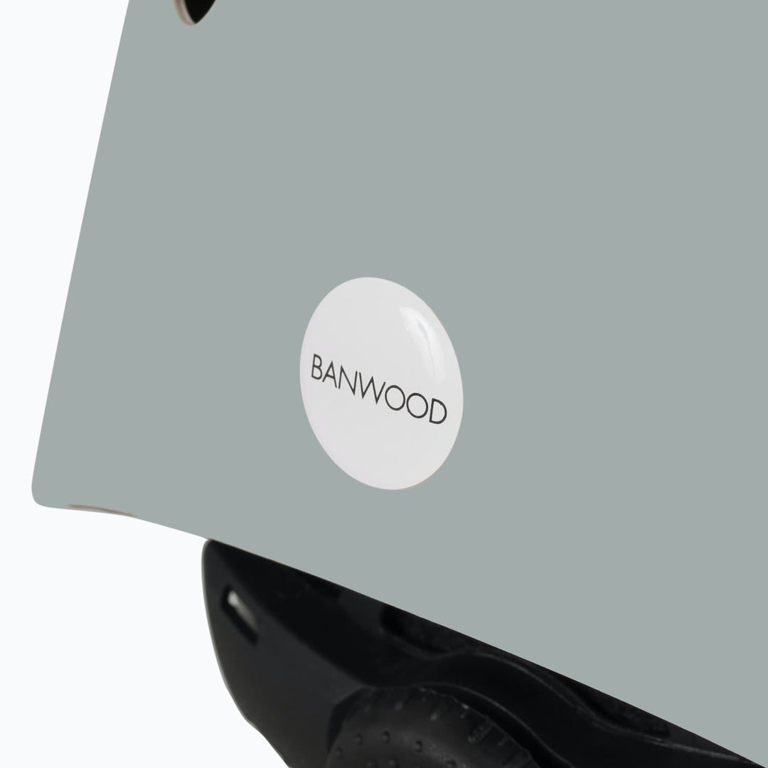 Clay colour helmet with a 'Banwood' label on a white background
