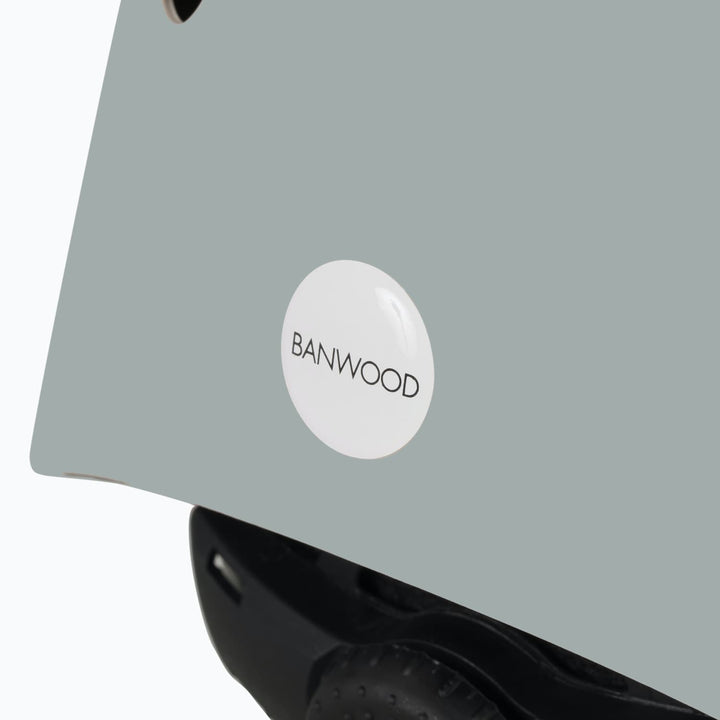 Clay colour helmet with a 'Banwood' label on a white background