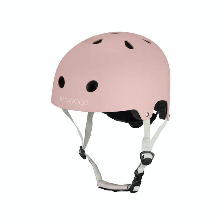 Dusty rose colour helmet with white straps on a white background