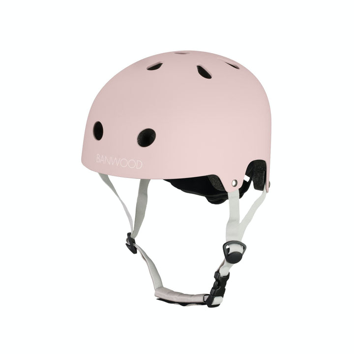 Pink helmet with white straps on a white background