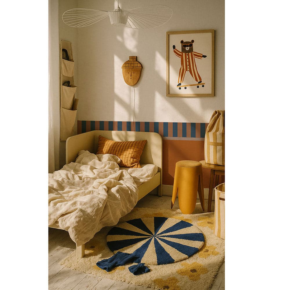 Children's bedroom with a bed, rug, and wall art