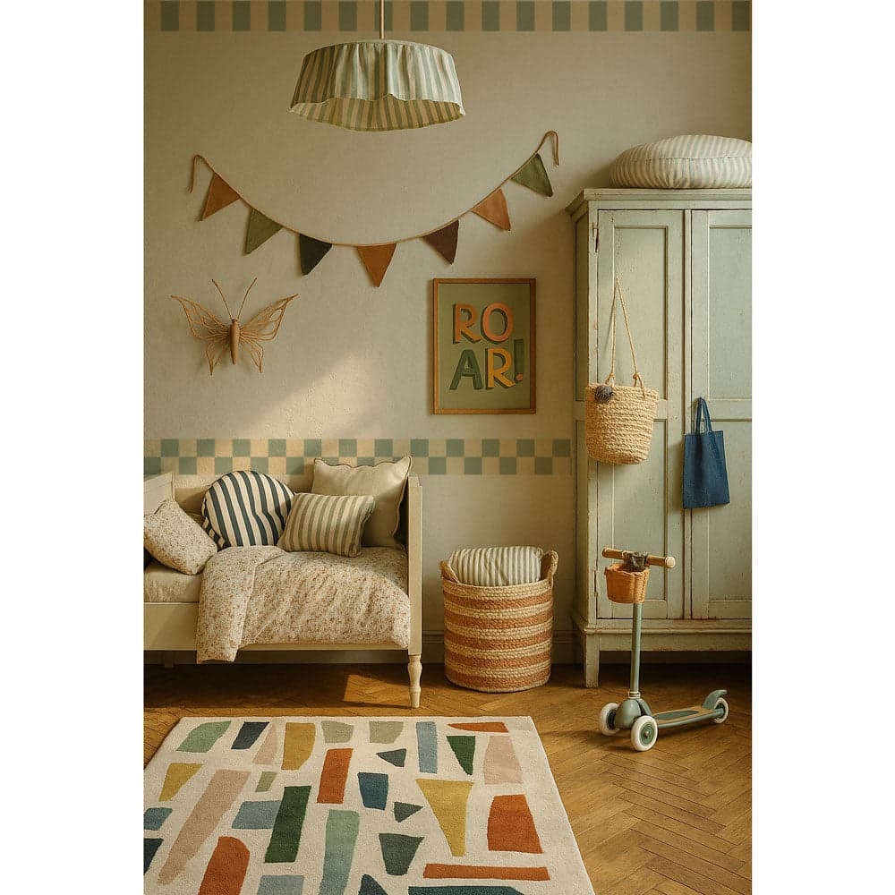 Children's room with a sofa, rug, and decorative elements.