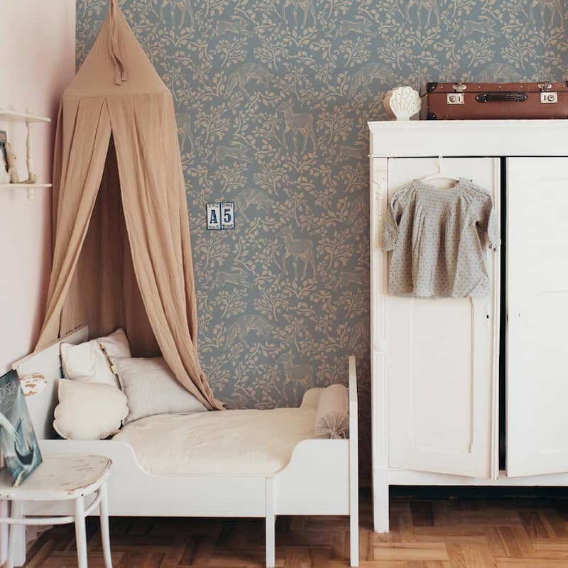 Dekornik Forest Animals & Fairytale Blue Wallpaper behind canopy, bed and dresser.