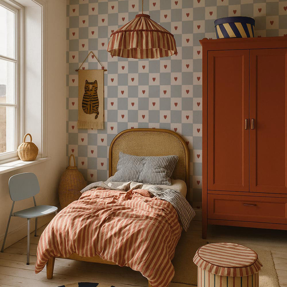 Children's bedroom with checkered wallpaper, orange wardrobe, and striped bedding.