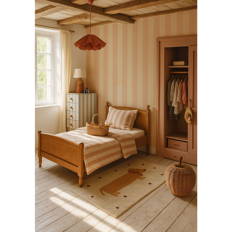 Children's bedroom with wooden bed, striped bedding, and a wardrobe.