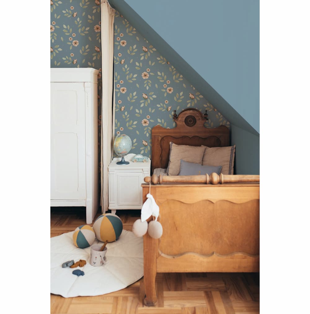 Dekornik Little Boho Flowers Blue Wallpaper behind wooden kids bed