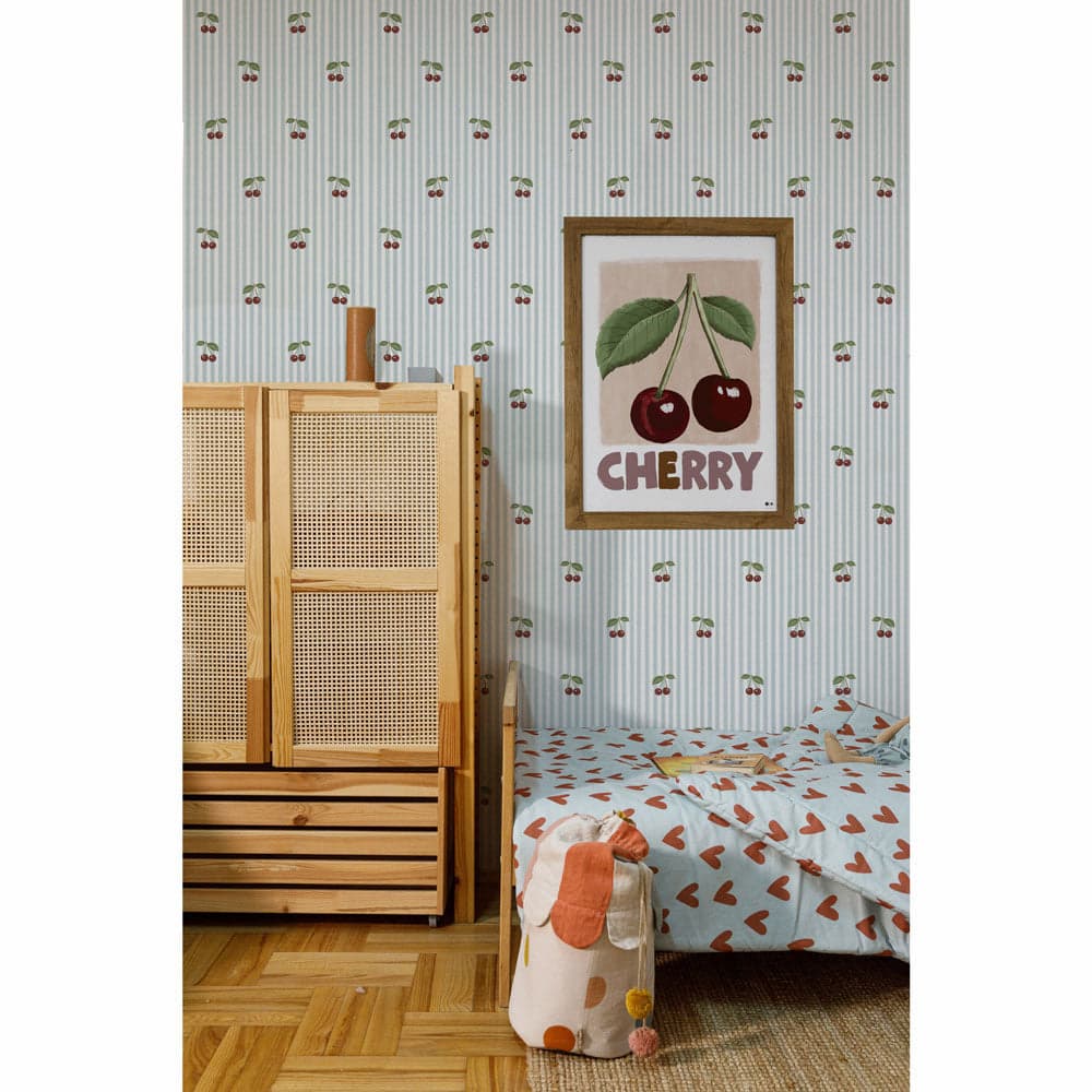 Children's room with wooden wardrobe, bed, and cherry-themed decor.