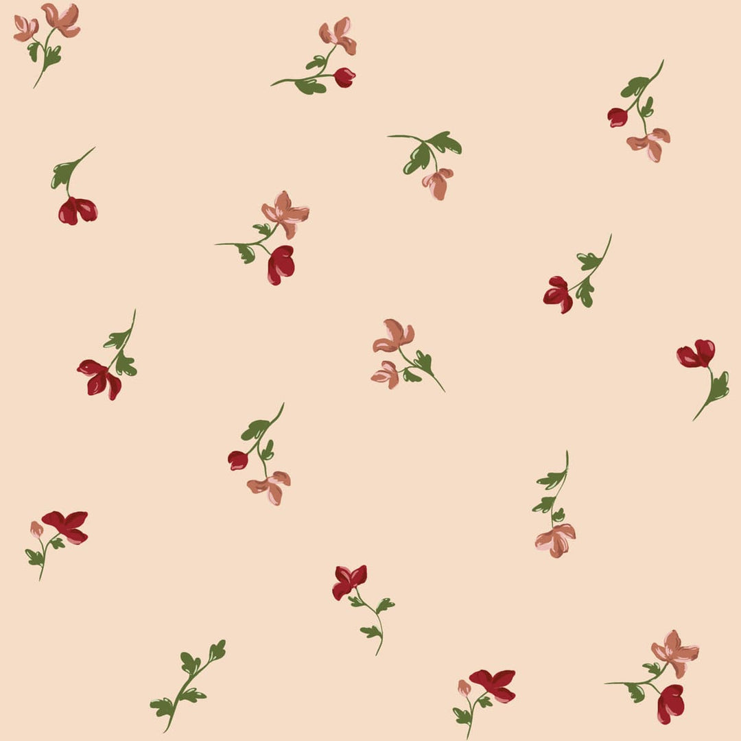 Pattern of small red and pink flowers on a light pink background