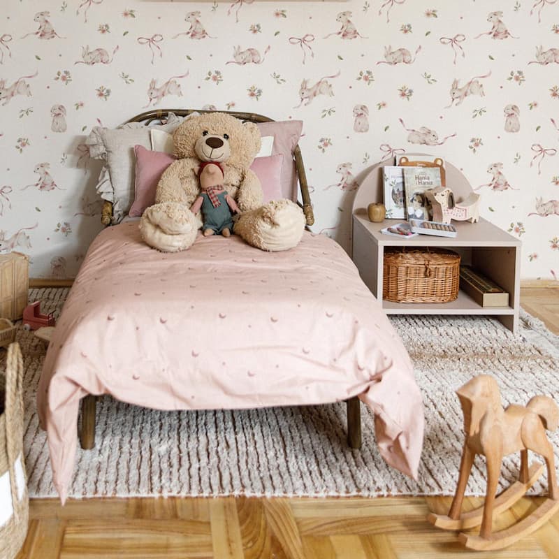 Dekornik Pink Rabbits On White Wallpaper behind bed