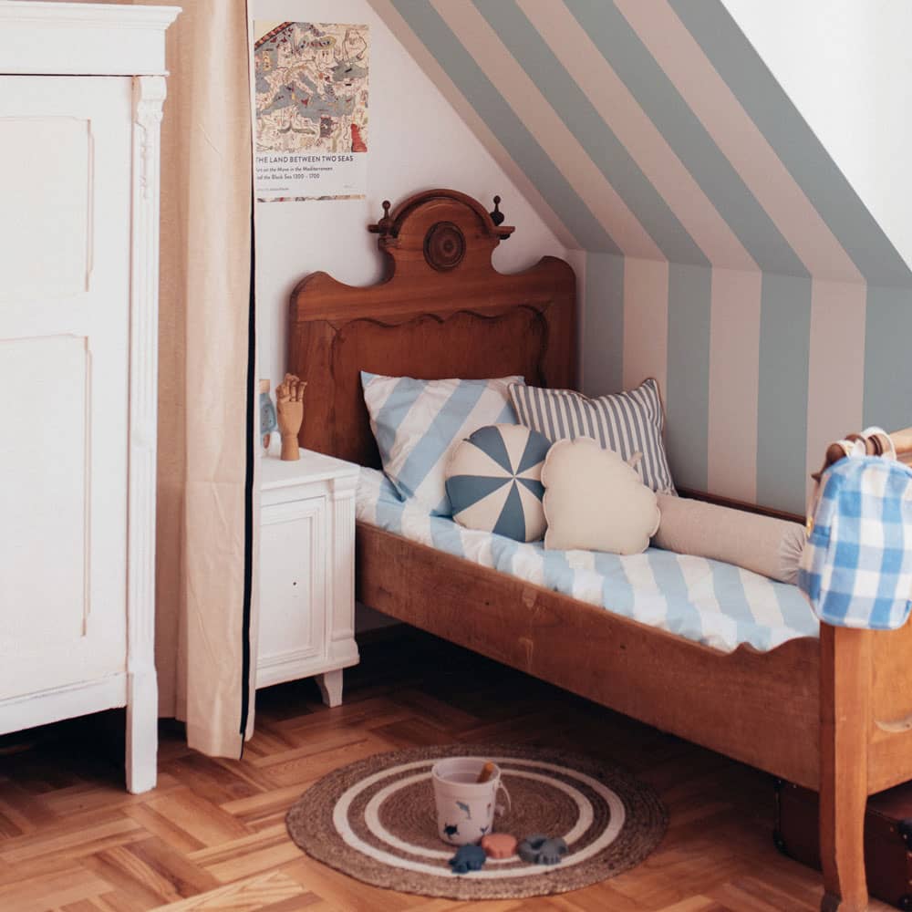 Dekornik Portofino Stripes Blue Wallpaper on bedroom slanted wall