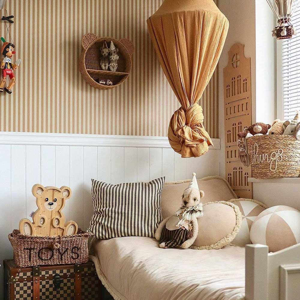 Children's bedroom with a bed, toys, and decorative elements.