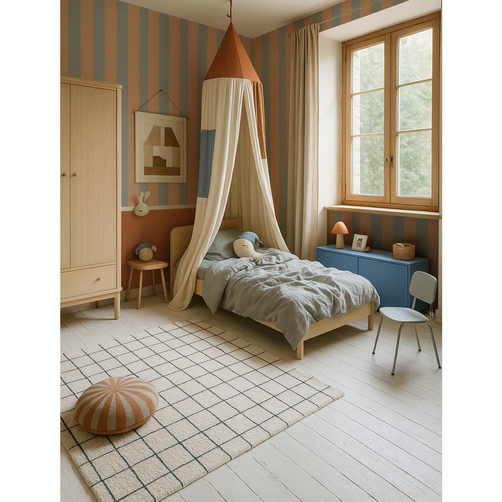 Children's bedroom with striped walls, canopy bed, and wooden furniture.