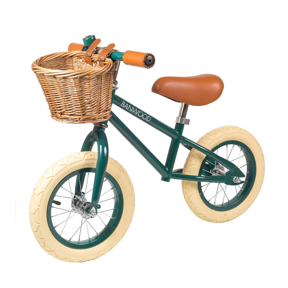 Green Banwood First Go Balance Bike with wicker basket