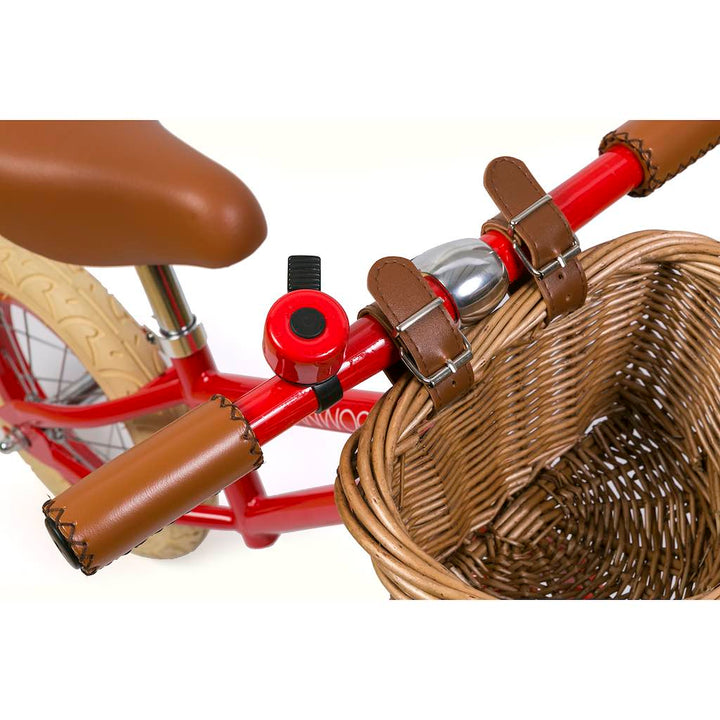 Close up of the red Banwood First Go Balance Bike  bell and handlebar