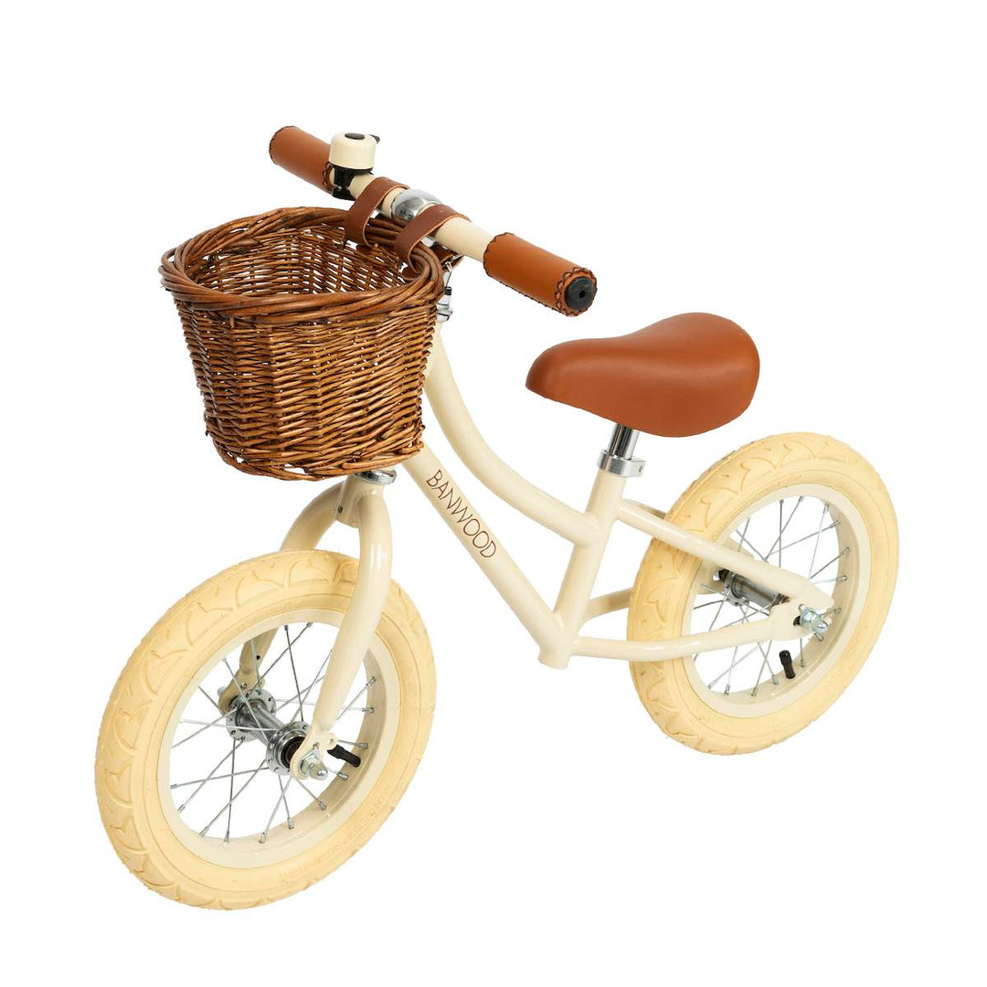 Cream Banwood First Go Balance Bike with wicker basket