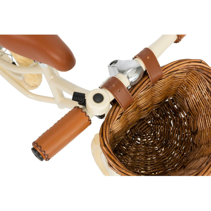 top view of the Cream Banwood First Go Balance Bike wicker basket and bell