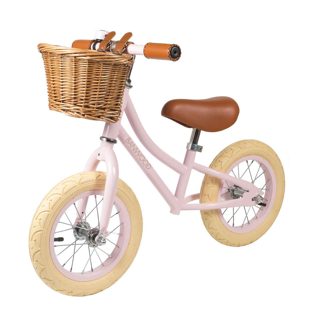 Pink Banwood First Go Balance Bike with wicker basket