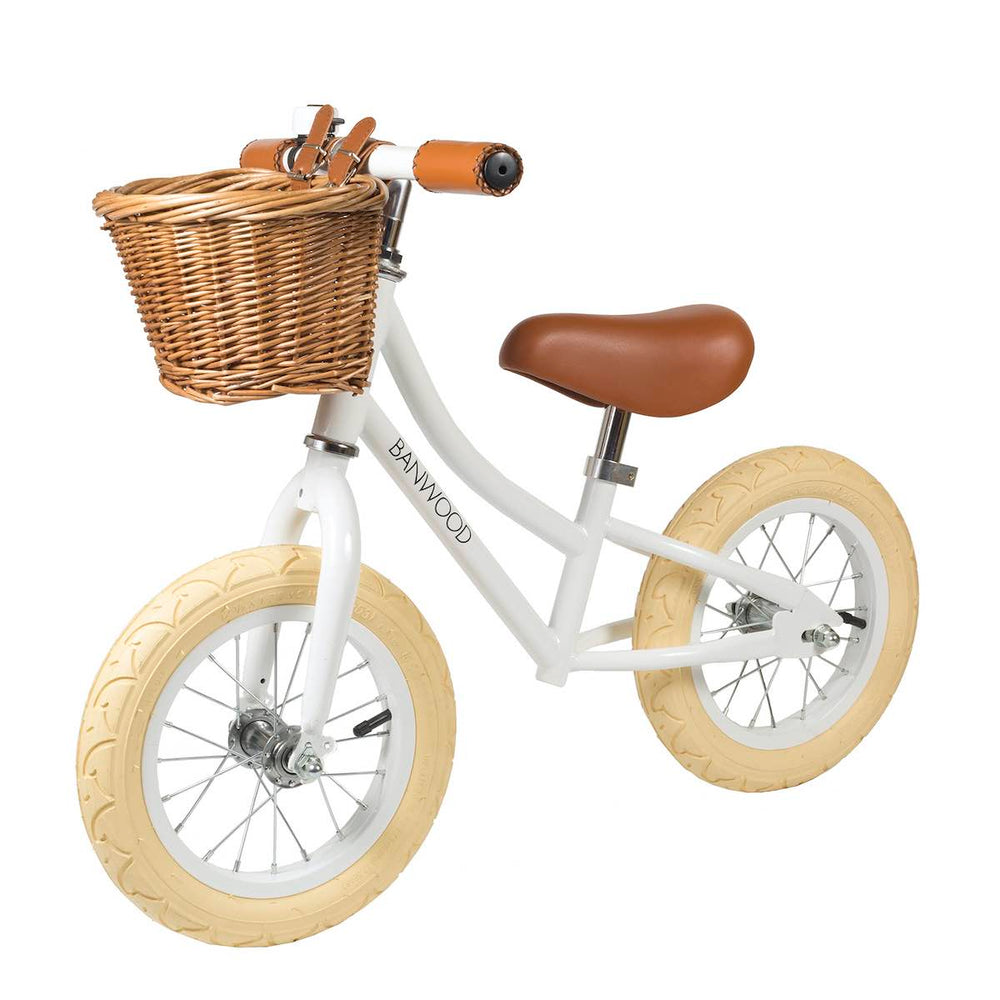 White Banwood First Go Balance Bike with wicker basket