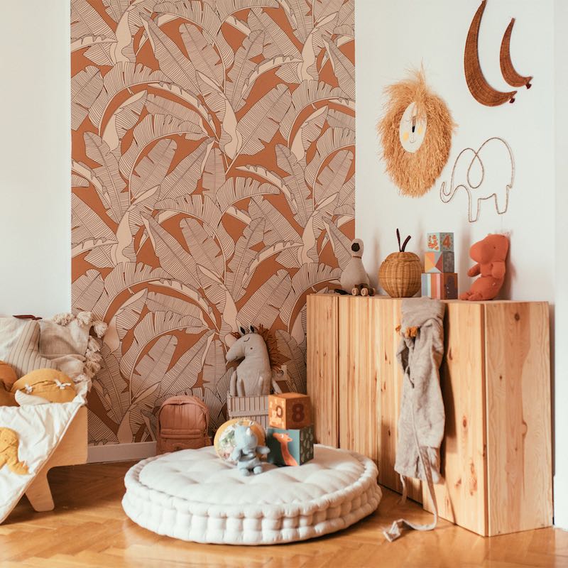 Dekornik CLASSIC Big Palm Leaves Ivory Cinnamon Wallpaper on bedroom accent wall